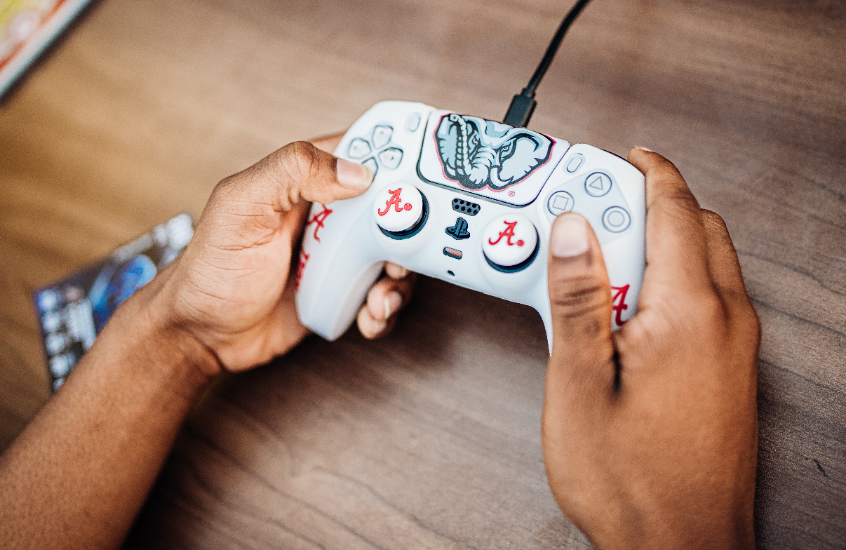 Alabama Crimson Tide PS5 controller in hands